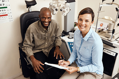 Buy stock photo Optometrist, doctor and vision specialist doing eye test on patient in a clinic. Portrait of happy, smiling and friendly practitioner writing notes while giving good service for optical prescription