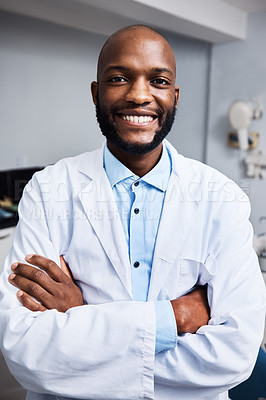 Buy stock photo Portrait of a confident young man working in a dentist’s office
