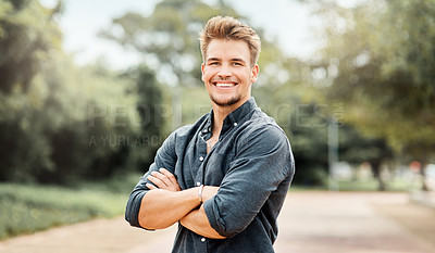 Buy stock photo Cropped portrait shot of a handsome young male student on outside campus