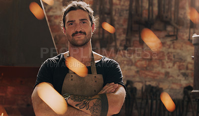 Buy stock photo Cropped shot of a man standing with his arms crossed in his workshop