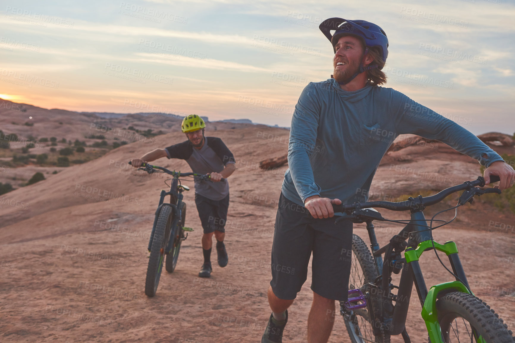 Buy stock photo Full length shot of two men out mountain biking together during the day