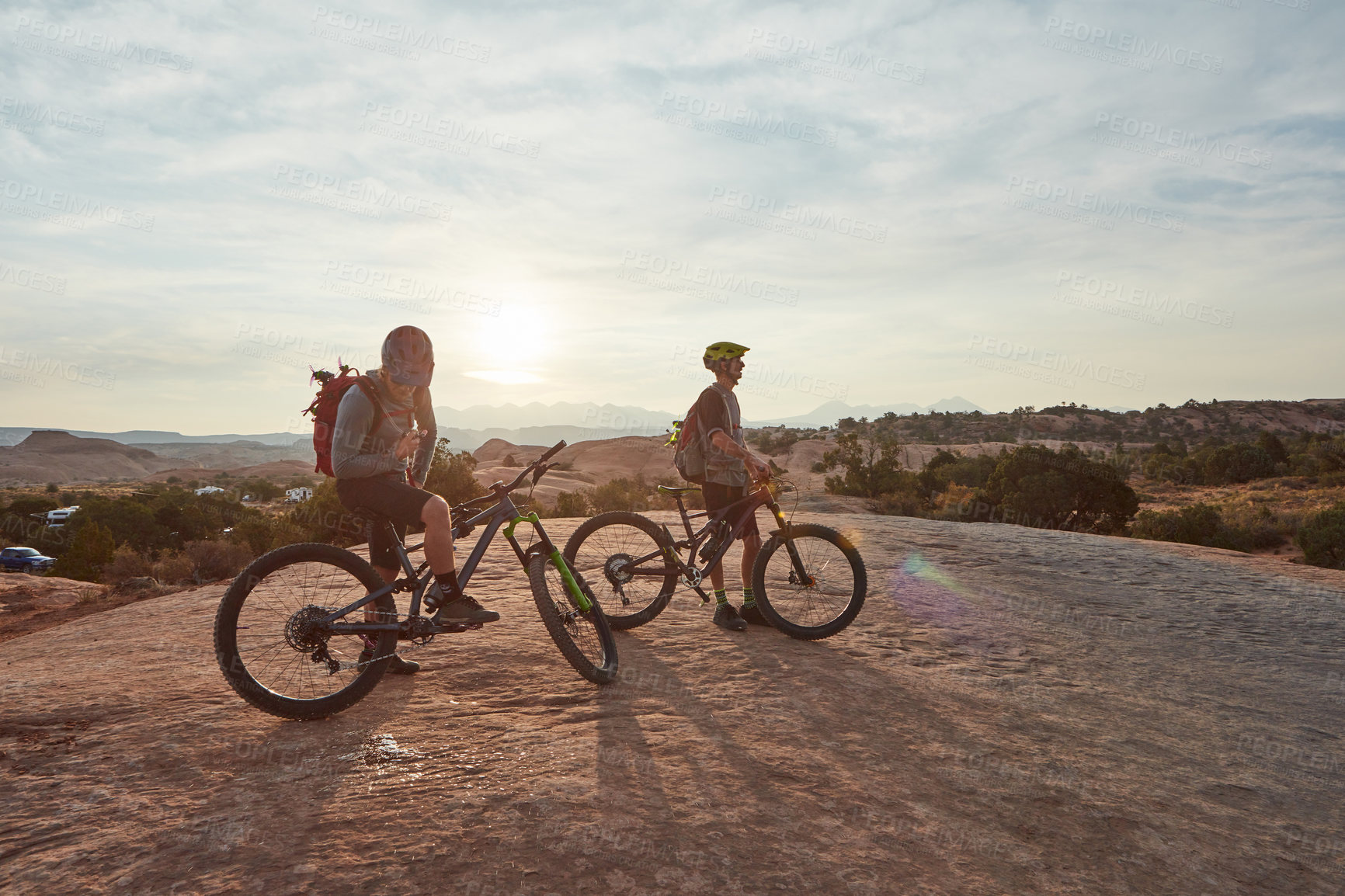 Buy stock photo Full length shot of two men out mountain biking together during the day