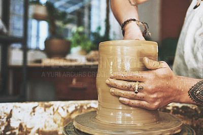 Buy stock photo Shot of an unrecognisable woman working with clay in a pottery studio