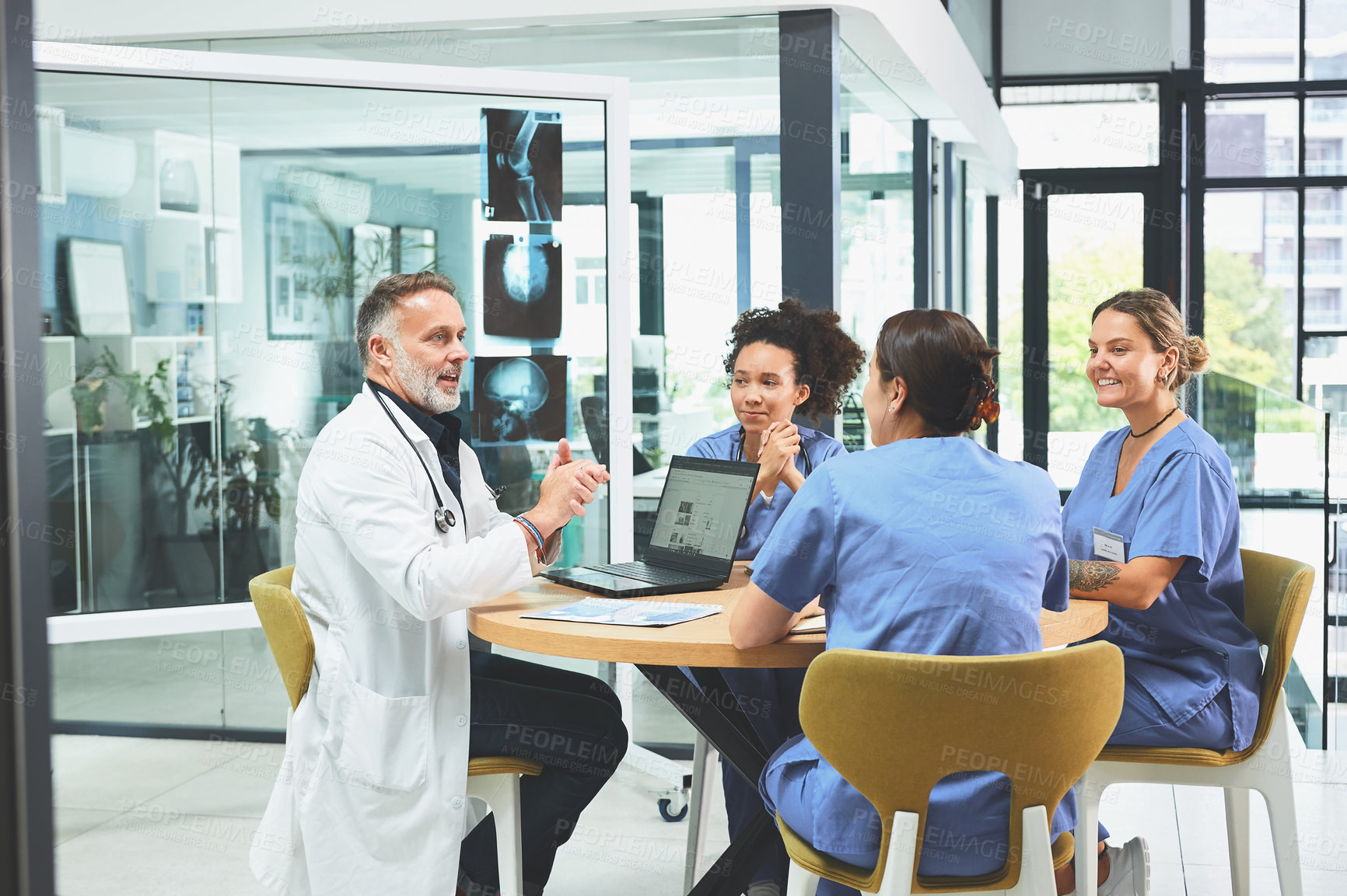 Buy stock photo Doctor, laptop and discussion with nurse in office for healthcare research, feedback and brainstorming. Medical, people and xray with meeting for neurology, internship and review of treatment plan