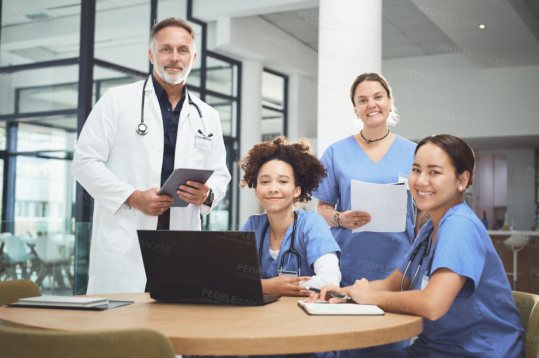 Buy stock photo Portrait of a team of doctors having a meeting in a hospital