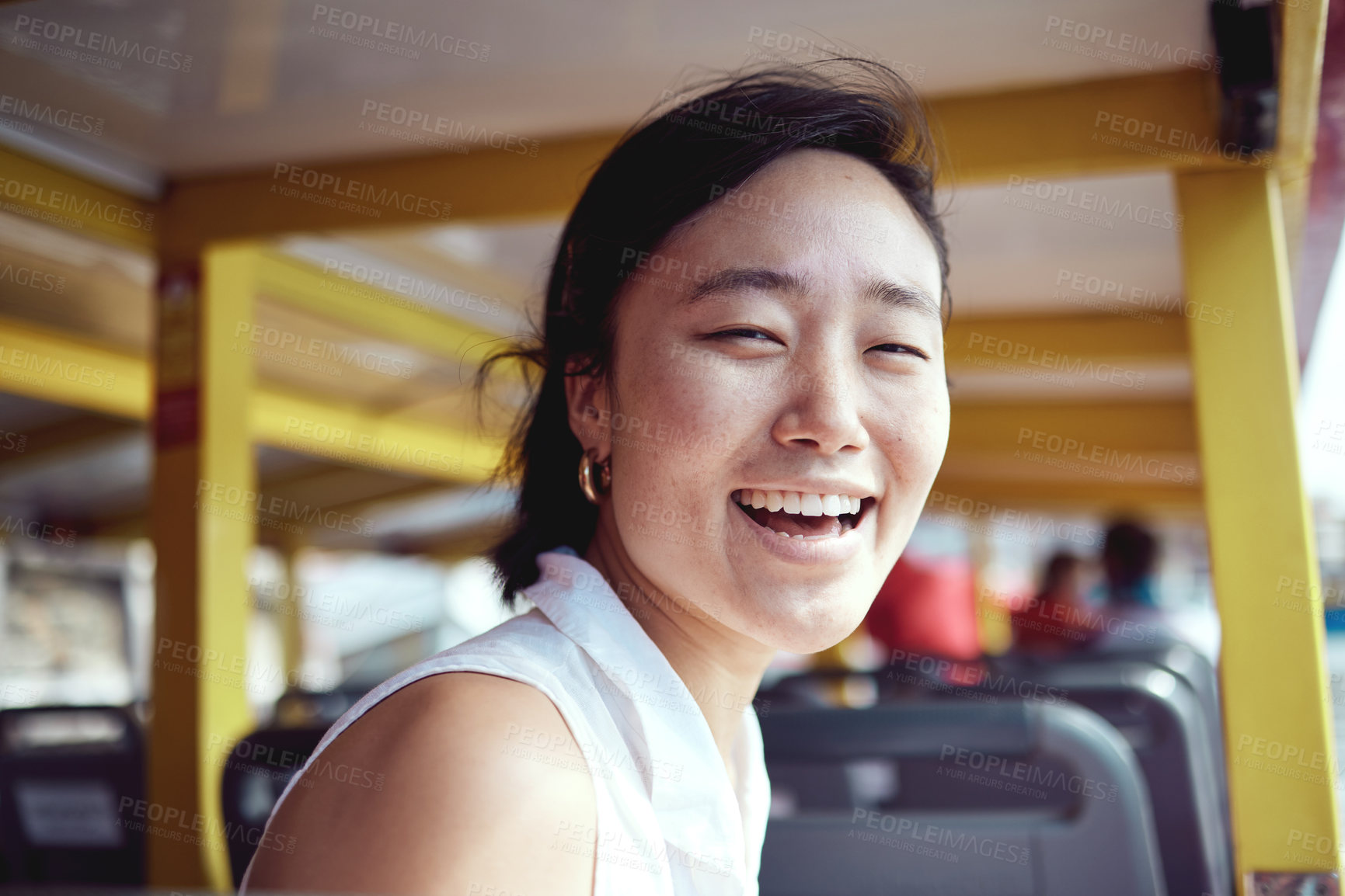 Buy stock photo Cropped portrait of an attractive young woman exploring the city alone on a ferry during the day