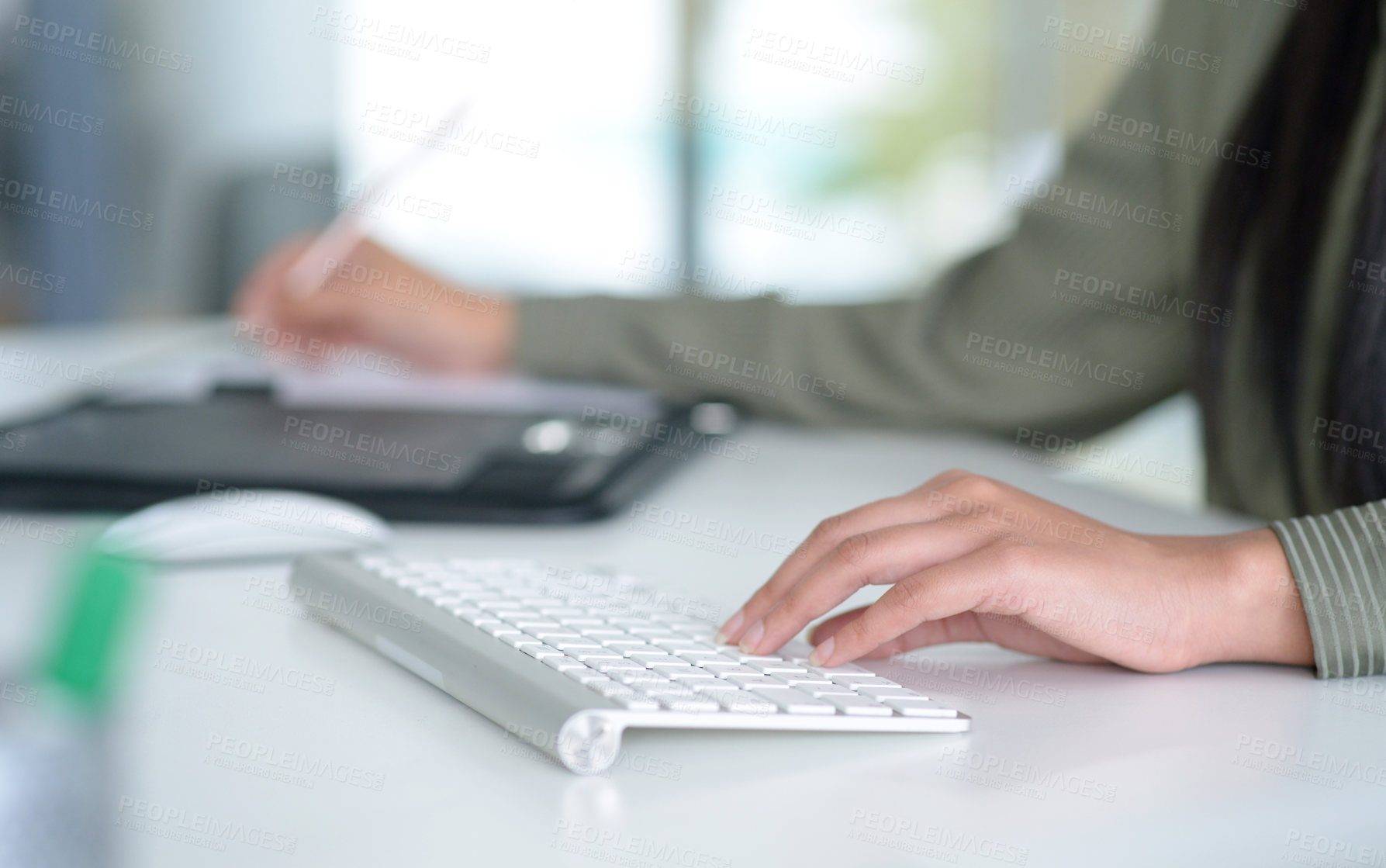 Buy stock photo Closeup shot of an unrecognisable businesswoman working on a computer in an office