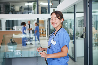Buy stock photo Cropped portrait of an attractive young nurse standing in the clinic during the day