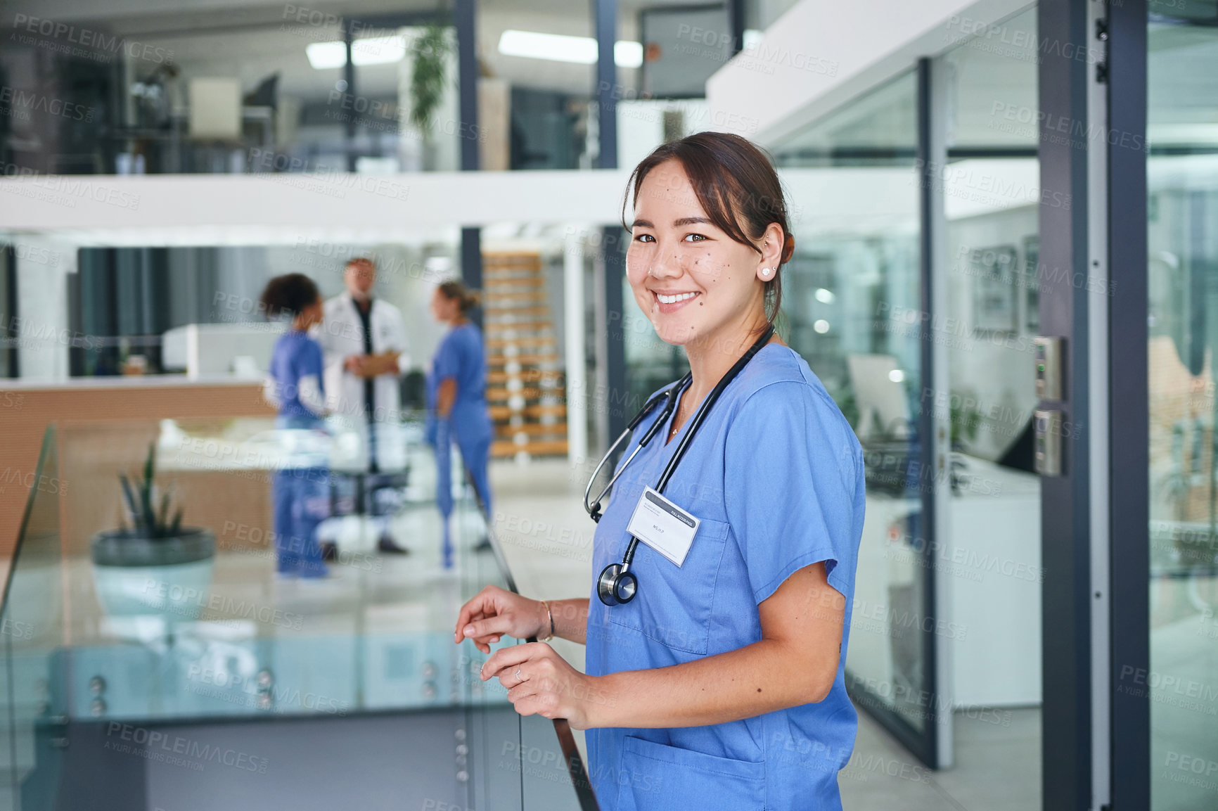 Buy stock photo Cropped portrait of an attractive young nurse standing in the clinic during the day