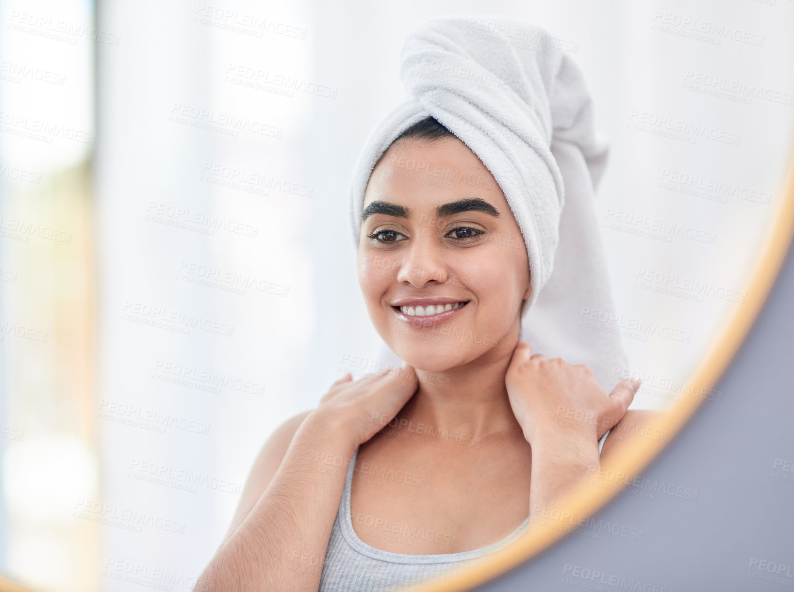 Buy stock photo Happy, woman and skincare with head towel and natural face with shine in mirror reflection. Female model, dermatology and facial treatment with smile for routine, wellness and spa care in bathroom 