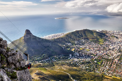 Buy stock photo Stunning city, mountain and ocean aerial view with cloudy sky background and copy space. Beautiful landscape of the calm sea on the horizon and Lions Head at a sightseeing location in Cape Town