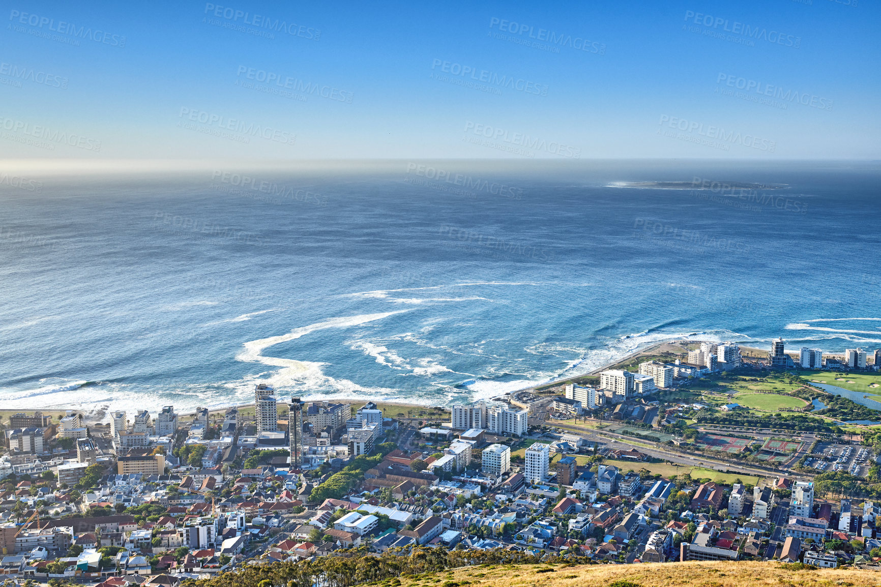 Buy stock photo Panoramic landscape view of the city Cape Town in South Africa. Beautiful scenic view of a popular tourist town with greenery and nature during summer. Ocean and residential in the Western Cape