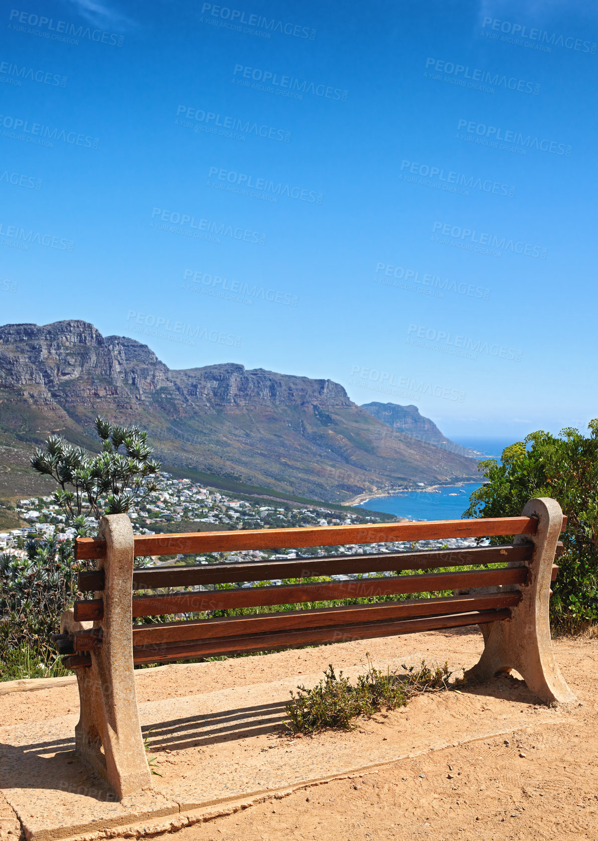 Buy stock photo Bench with a relaxing view from Table Mountain, Cape Town, South Africa, soothing scene of Lions head against blue sky. Relaxing resting place along a hiking trail, with peaceful harmony in nature 