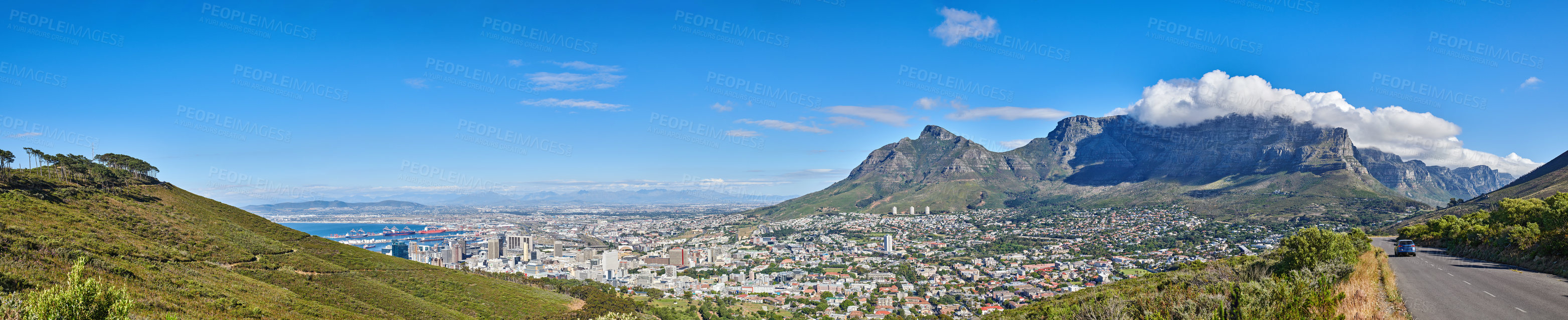 Buy stock photo Mountain landscape and panorama view of coastal city, residential buildings or infrastructure in famous travel or tourism destination. Copy space and scenic blue sky of Table Mountain in South Africa