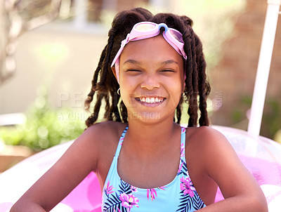 Buy stock photo Cropped shot of a young girl wearing swimming goggles and a bathing suit