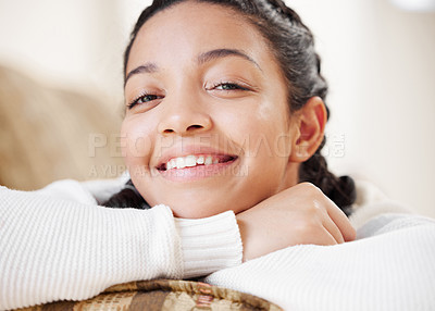 Buy stock photo Portrait of a young woman relaxing on the sofa at home