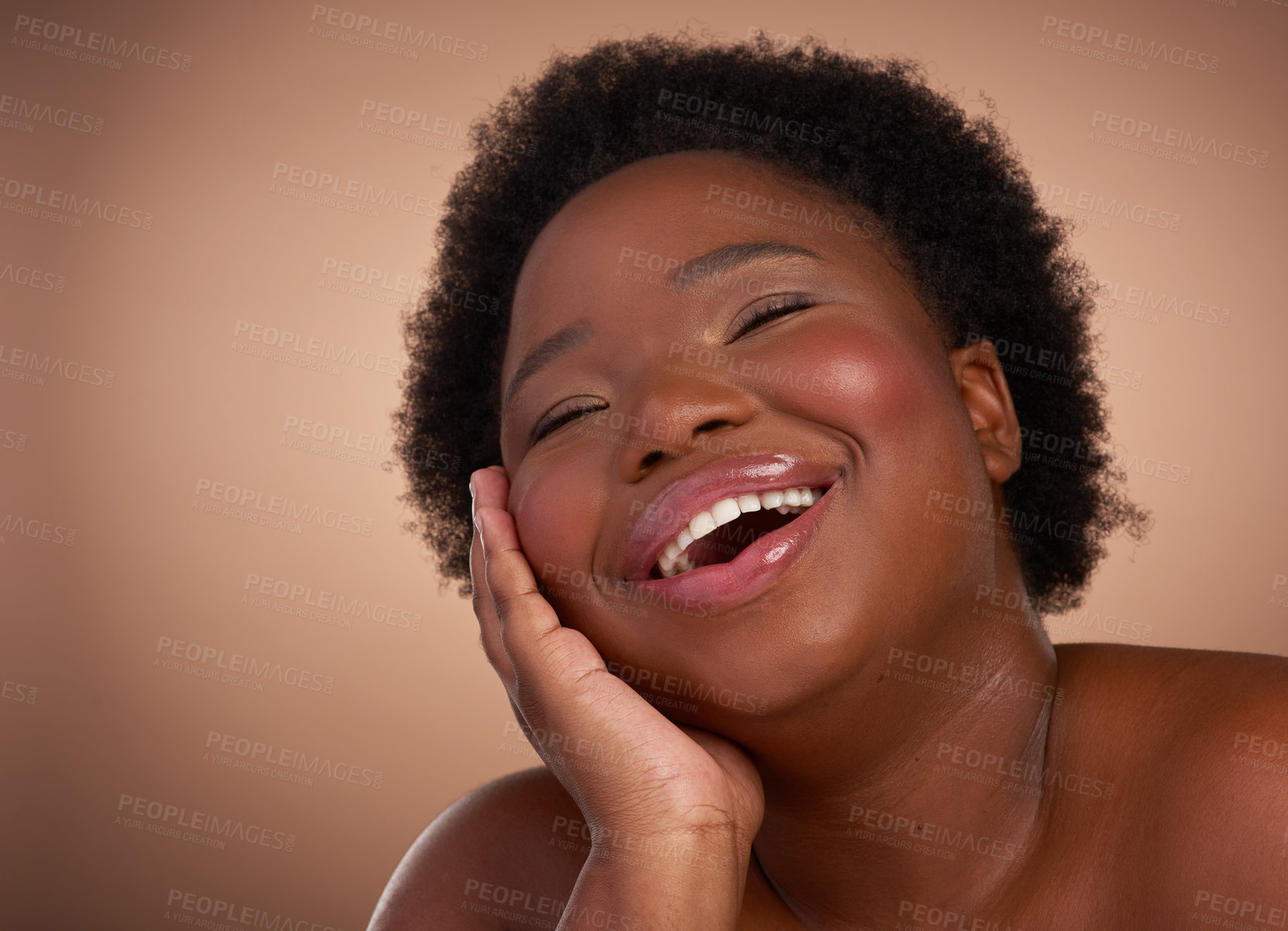 Buy stock photo Studio shot of a beautiful young woman looking happy against a brown background