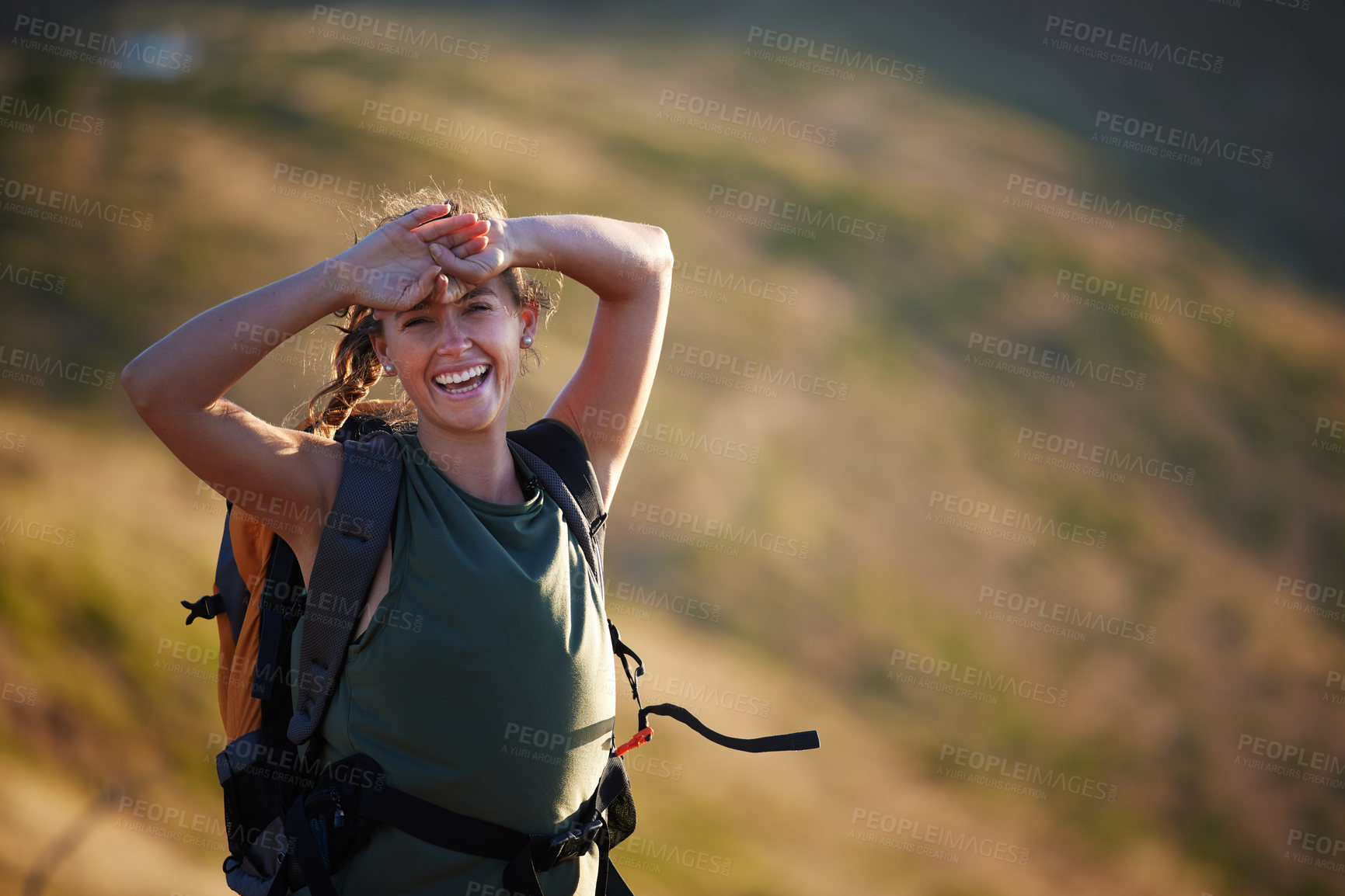 Buy stock photo Shot of a beautiful young woman wearing a backpack while out hiking