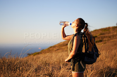 Buy stock photo Woman, drink water and hiking outdoor for fitness or travel, thirst and hydration with exploring nature. Backpacking, adventure and trekking in New Zealand with h2o drink for nutrition and health