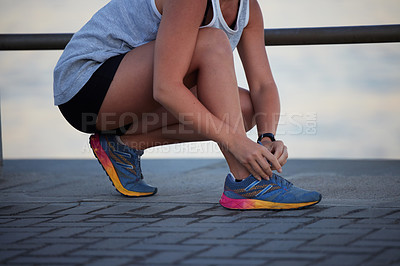 Buy stock photo Woman, hands and running shoes with lace for fitness, exercise and wellness with training for health. Sportswear, workout and active with never give up for perseverance with cardio for athlete