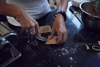 Buy stock photo Person, hands and cooking pasta at home with fork on kitchen counter and healthy diet. Woman, chef and food with mixing bowl for nutrition, preparation and handmade ravioli for balanced meal