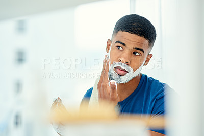 Buy stock photo Morning, mirror and shaving with man in bathroom for grooming, hair removal and cleaning. Skincare, razor and self care with face of male person and foam at home for facial, beard and hygiene