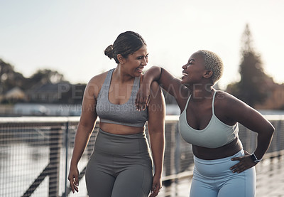 Buy stock photo Shot of two friends out for a workout together