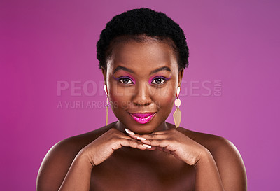 Buy stock photo Studio shot of a beautiful young woman posing against a purple background