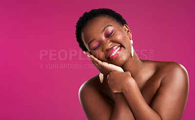Buy stock photo Studio shot of a beautiful young woman posing against a pink background