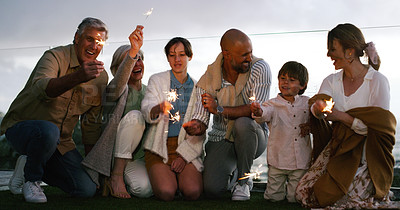 Buy stock photo Outdoor, happy and family with fireworks, celebration and party with fun, backyard and cheerful together. Grandparents, mother and father with children, kids and happiness with sparklers and love