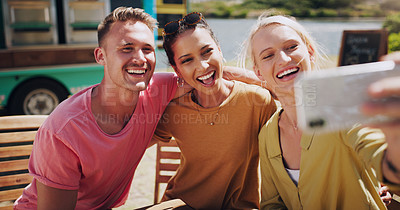 Buy stock photo Smile, friends and selfie with smartphone outdoor for bonding, profile picture or update for social media. Happy people, man and women for photo memories, image moment and weekend trip with mobile
