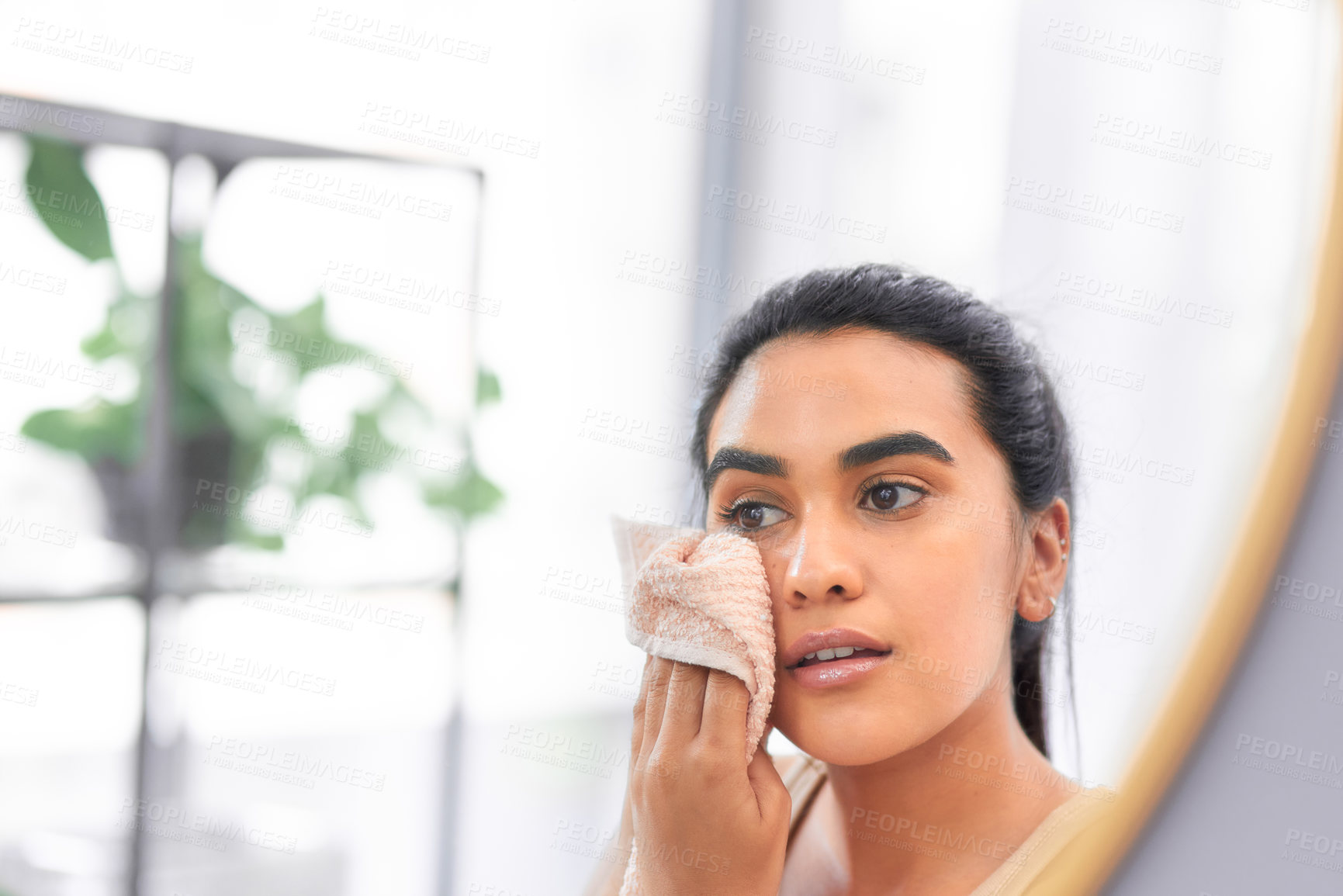 Buy stock photo Shot of a young woman drying her face with a towel at home