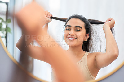 Buy stock photo Beauty, mirror and happy woman with hair check. in bathroom with soft, texture or growth satisfaction at home. Haircare, reflection and gen z girl with ponytail in house cosmetic, shine or routine