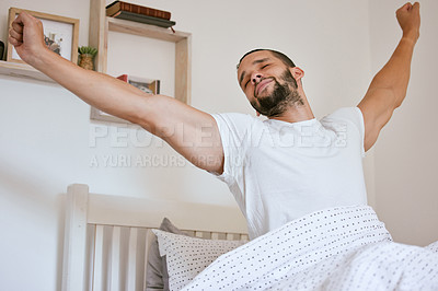 Buy stock photo Morning, stretching and man wake up in bed with peace, rest and calm satisfaction from sleeping at home. Awake, stress relief and lazy person in bedroom with body, movement or comfort in a house