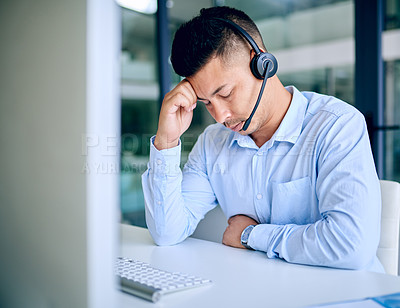 Buy stock photo Call center, man and headset with computer, tired and customer service for telemarketing, sales and help. Company, agent and corporate with internet, consulting and stress with headache and anxiety