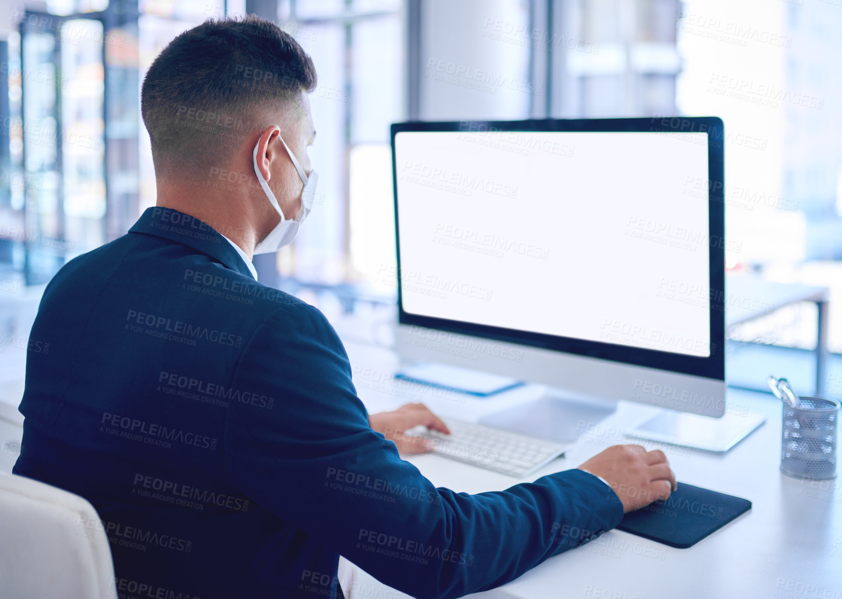Buy stock photo Business man, face mask and computer with mockup space and blank screen at investment company. Working, internet and stock exchange research of a financial investor with virus safety equipment
