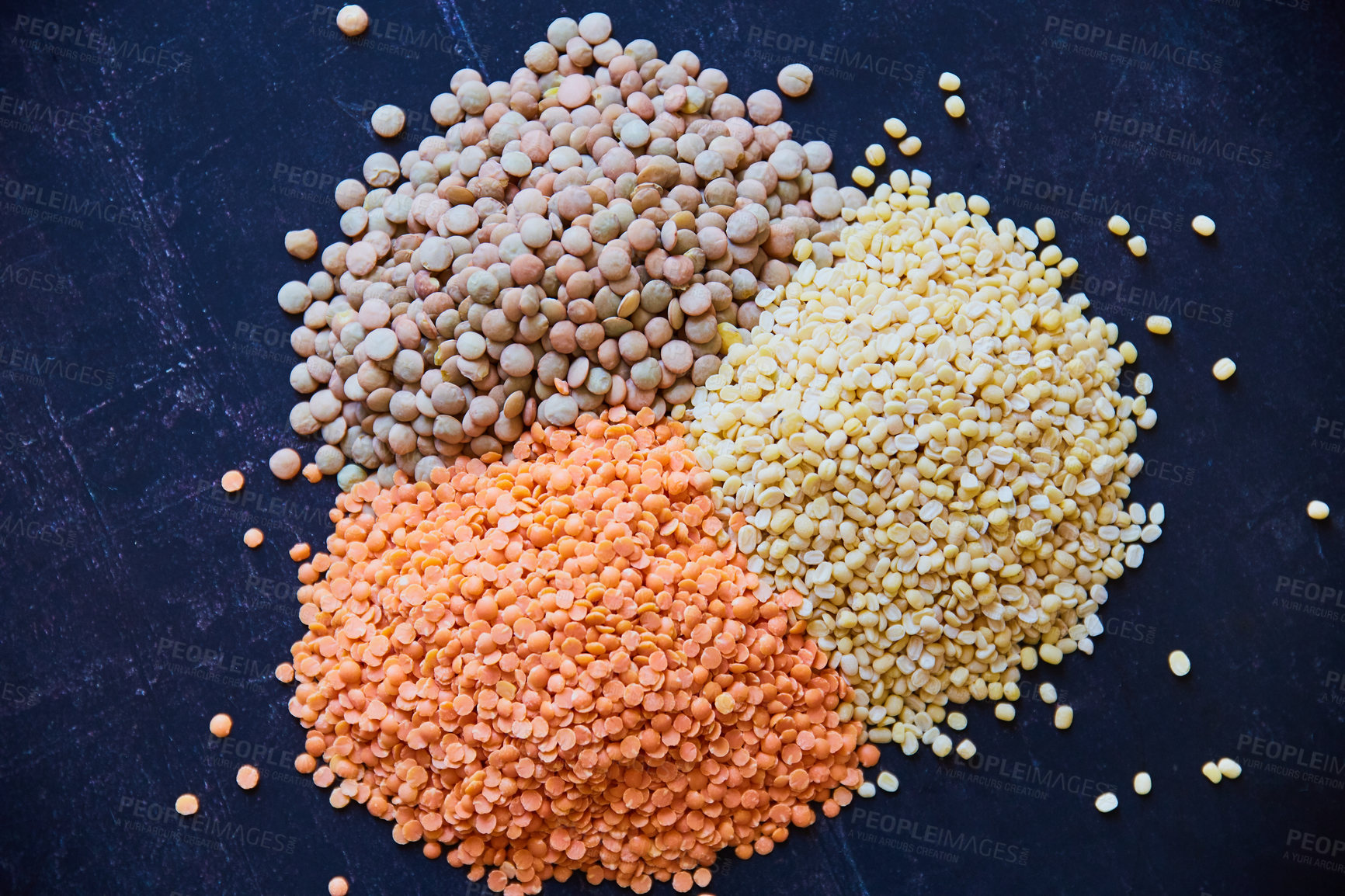 Buy stock photo Overhead shot of assorted legumes on a slate plate