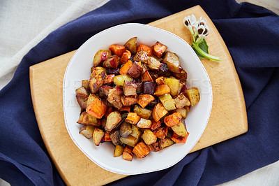 Buy stock photo Overhead shot of roasted sweet potatoes in a white serving bowl