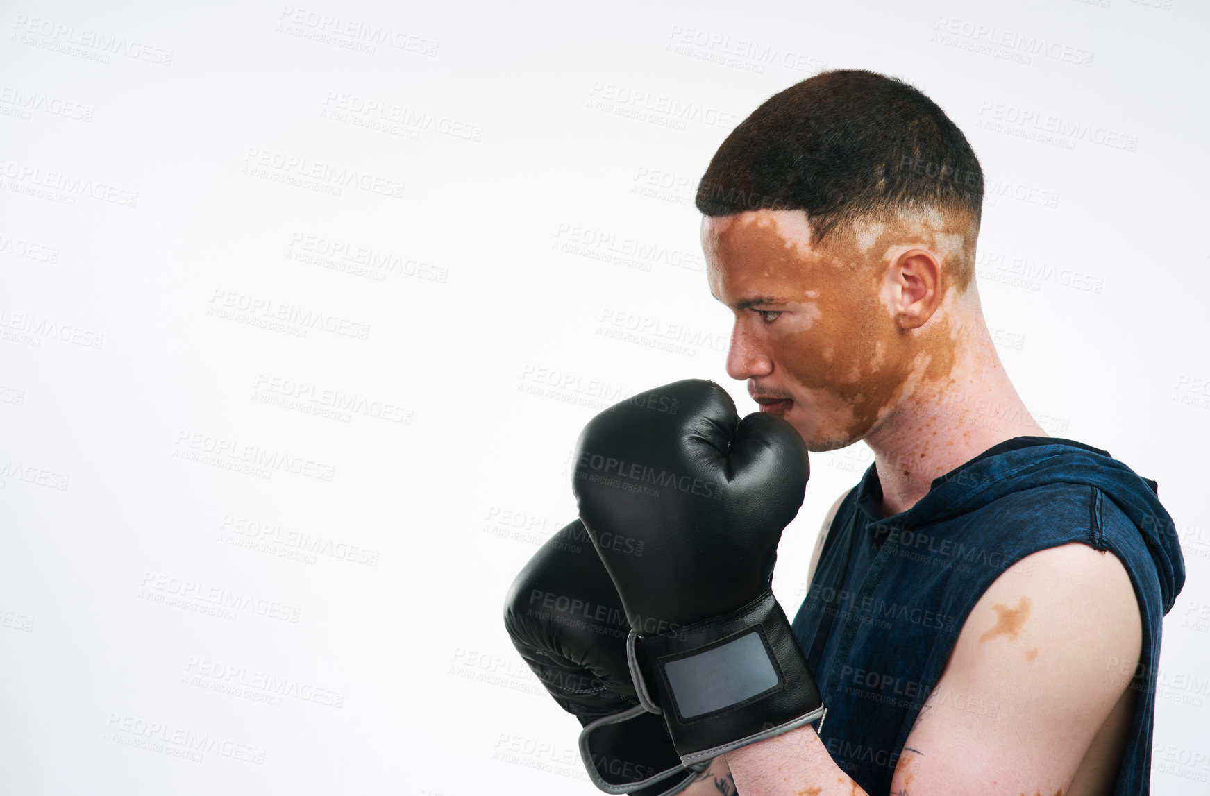 Buy stock photo Vitiligo man, profile and boxer with gloves for fight, tournament or boxing match on a white studio background. Male person or fighter ready for self defense, challenge or competition on mockup space