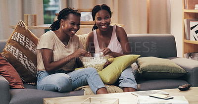 Buy stock photo Movie night, happy and women with popcorn on the sofa for a television show, film or comedy. Smile, relax and African friends on the couch eating food and streaming a subscription service on tv