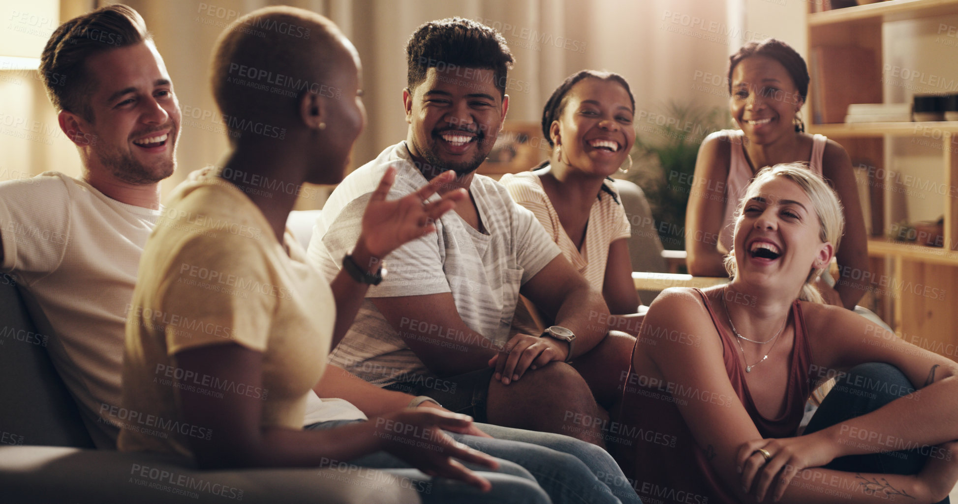 Buy stock photo Shot of a group of a diverse group of friends relaxing in the lounge at home