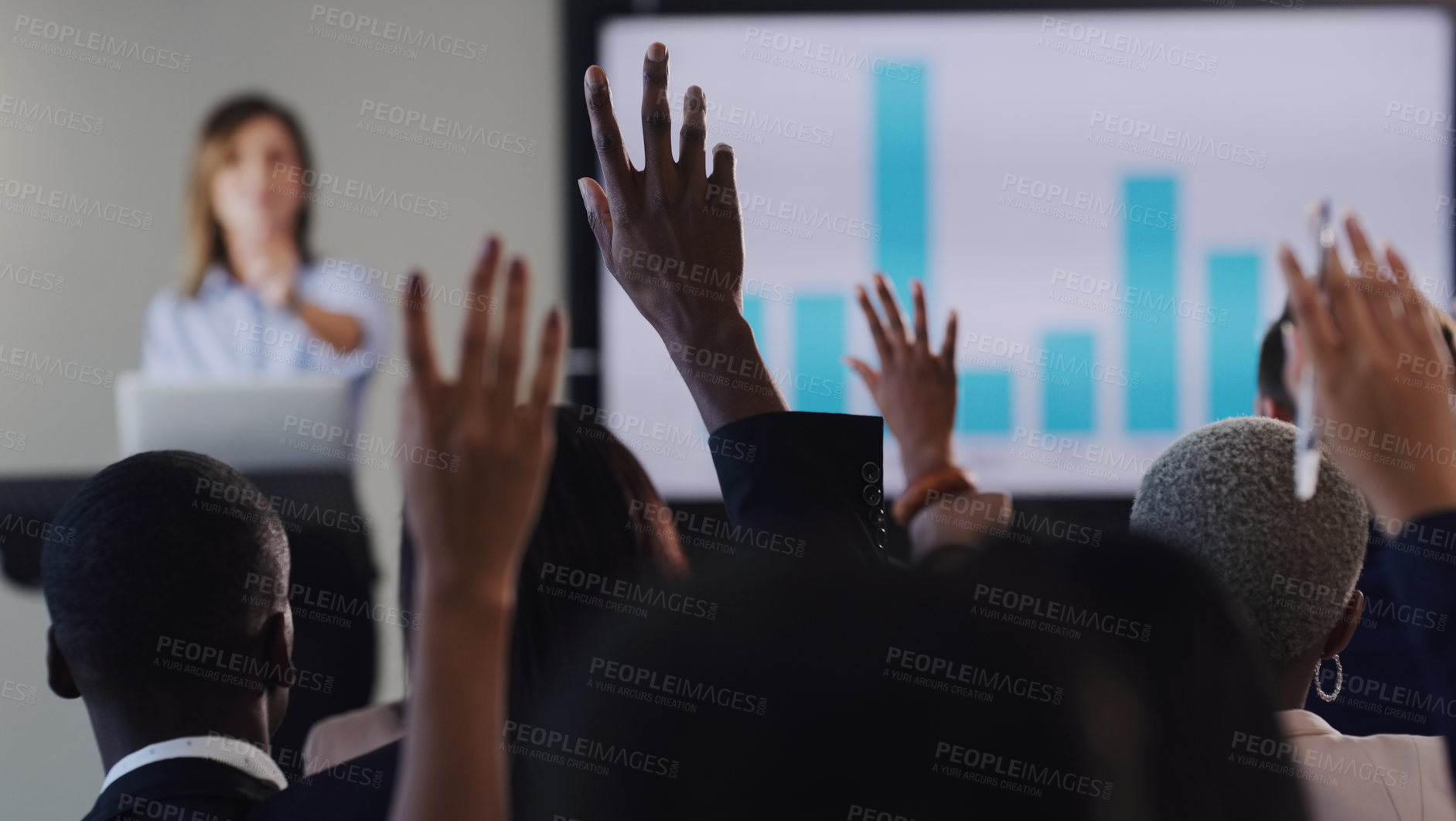Buy stock photo Rearview shot of a group of businesspeople raising their hands during a conference in an office