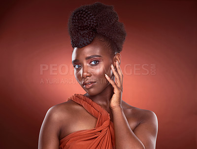 Buy stock photo Confident, black woman and makeup with hands in studio for beauty or glamour by red background. Pride, African and female person and cosmetic with foundation for glow or shine as model in Nigeria