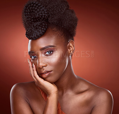 Buy stock photo Portrait, beauty makeup and skincare of black woman in studio for wellness, dermatology or aesthetic isolated on red background. Face, touch and cosmetics of serious African model for shine or glow