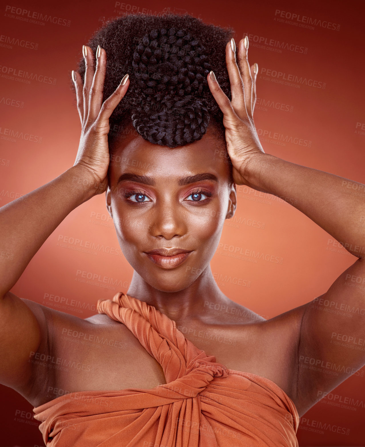 Buy stock photo Cropped portrait of an attractive young woman posing in studio against a red background