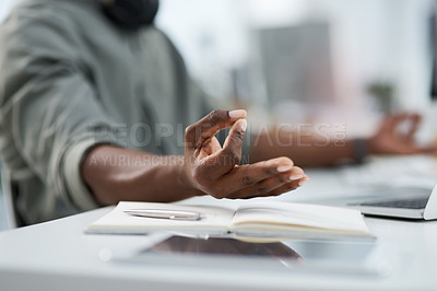 Buy stock photo Cropped shot of a young man meditating at work