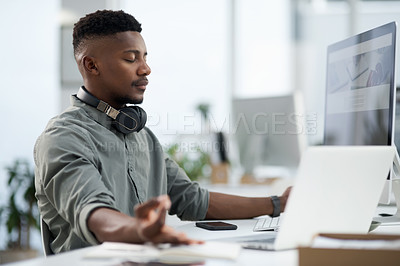 Buy stock photo Shot of a young man meditating in at work
