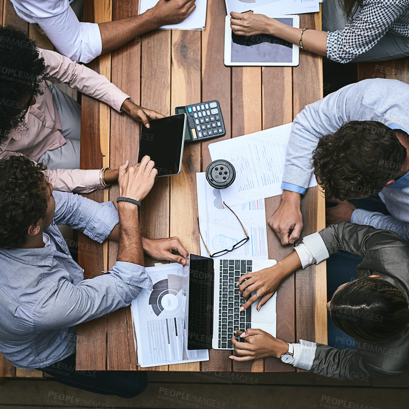 Buy stock photo High angle shot of a team of businesspeople having a meeting outside