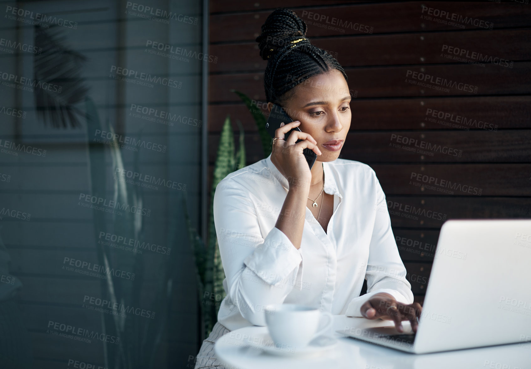 Buy stock photo Black woman, phone call and laptop for typing in office, digital notes and calendar app for schedule. Female person, talking and contact business client for negotiation on deal, online and discuss