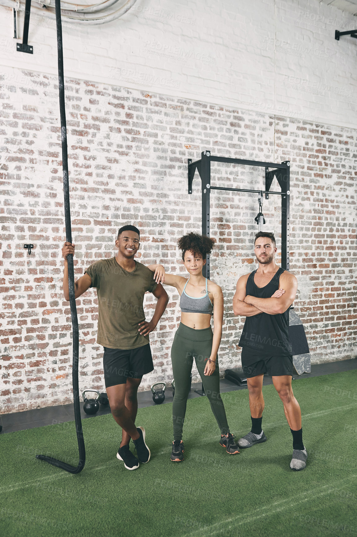 Buy stock photo Shot of a fitness group standing together in the gym